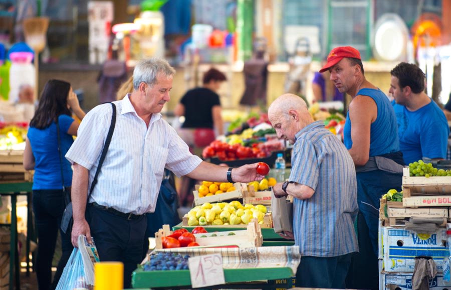 Man buying vegetables at Sarajevo Market, Bosnia and Herzegovina